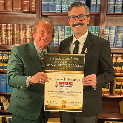 Dr. Steven Krivolavek receiving his back pain treatment award